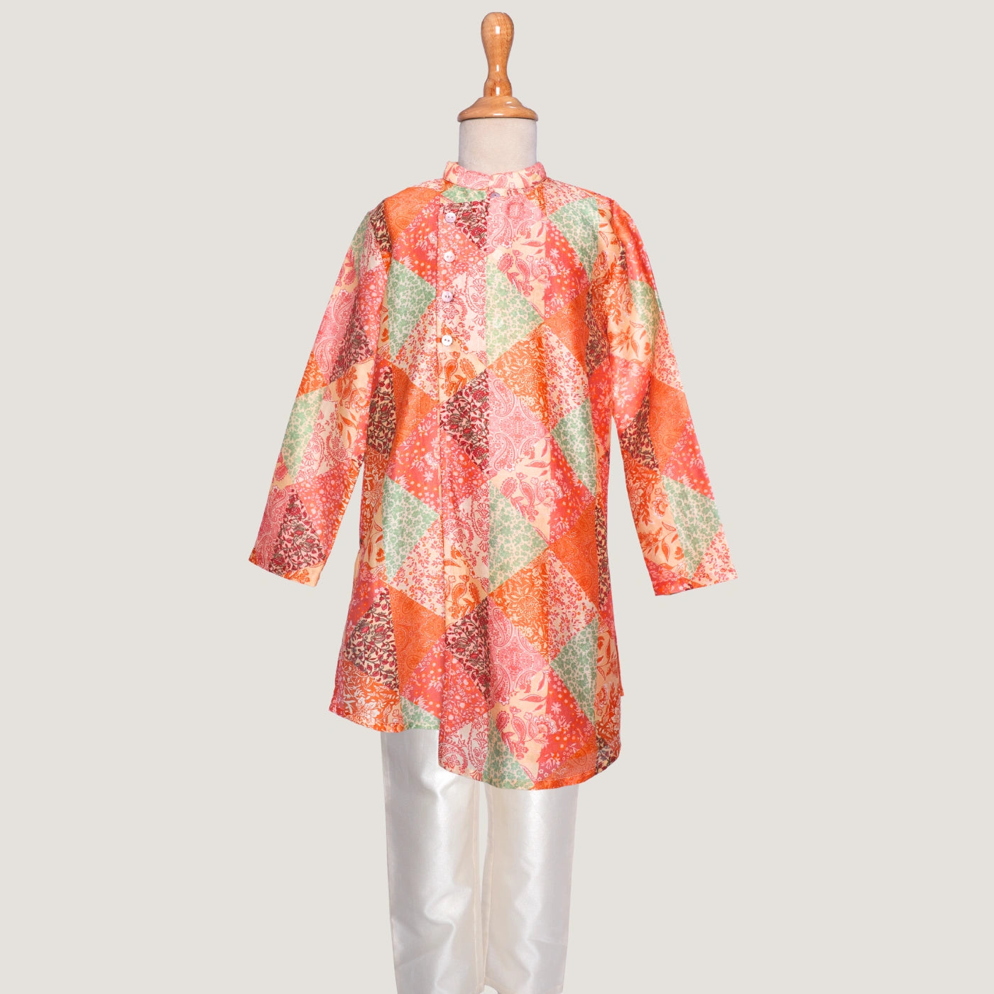 The kurta showcases an asymmetrical front with all-over tie-up detailing, giving it a unique, festive edge rooted in tradition.