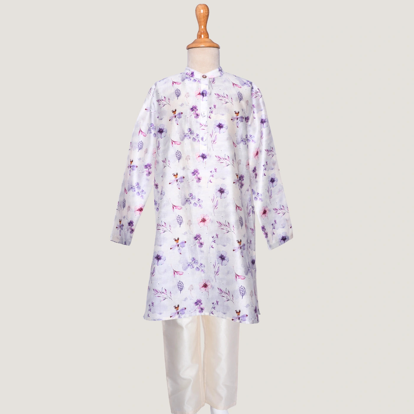 Lavender dress on a mannequin against a plain background