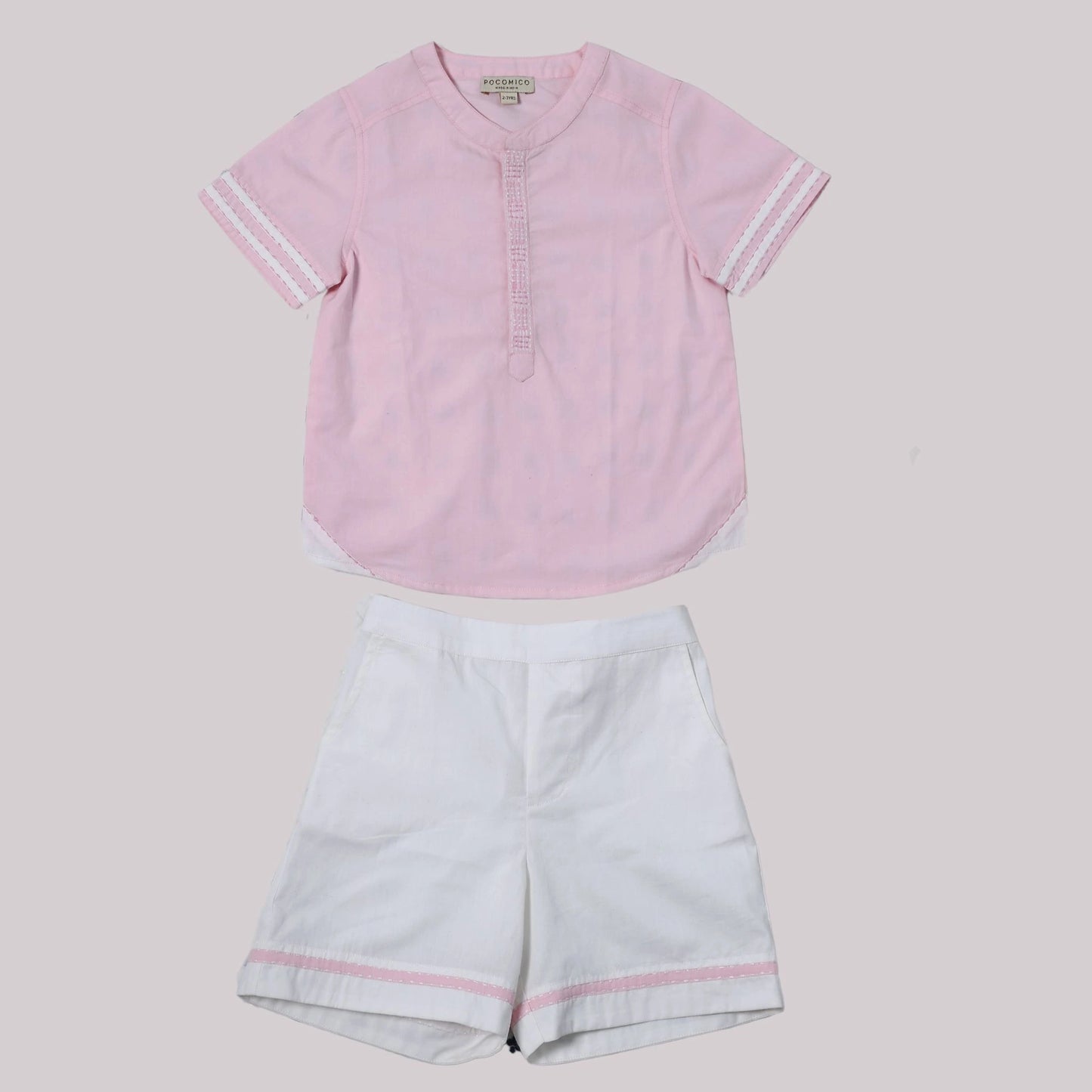 Boys pink cotton shirt with Chinese collar and contrast embroidery, paired with white pants.