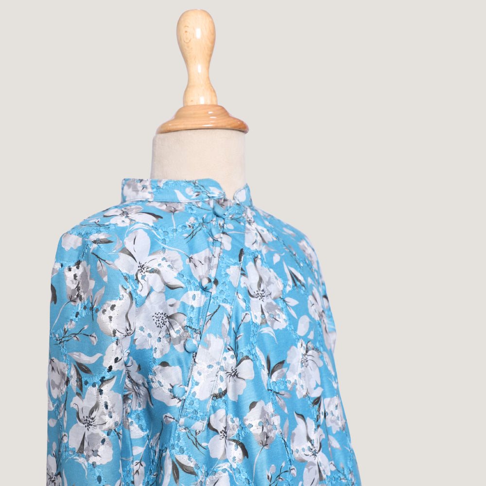 
                  
                    Boys-Morning-Glory-Kurta-Set-in-blue-chanderi-fabric-with-floral-prints-and-beadwork, paired-with-soft-cotton-pyjamas-for-comfort.
                  
                