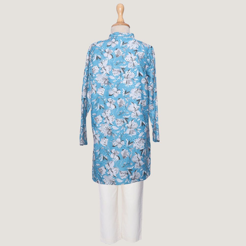 
                  
                    Boys-Morning-Glory-Kurta-Set-in-blue-chanderi-fabric-with-floral-prints-and-beadwork, paired-with-soft-cotton-pyjamas-for-comfort.
                  
                
