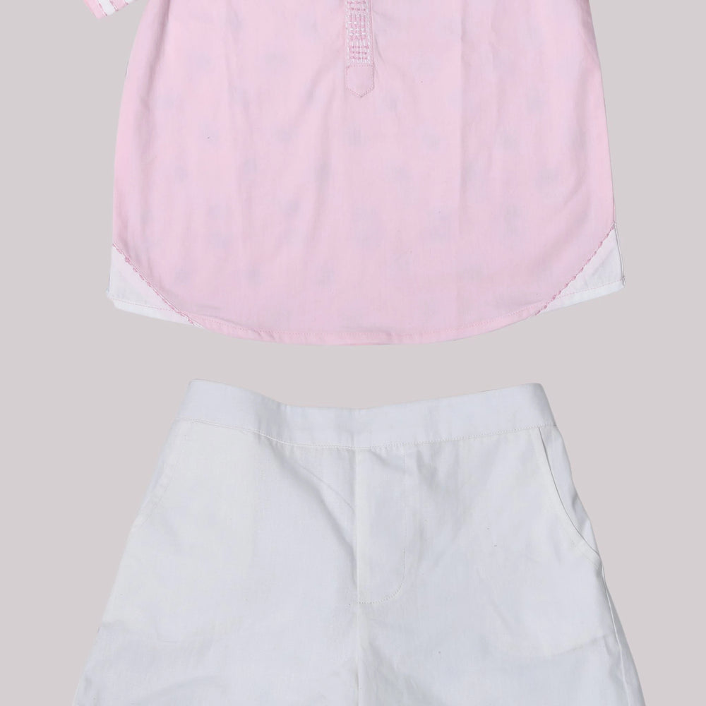 
                      
                        Boys pink cotton shirt with Chinese collar and contrast embroidery, paired with white pants.
                      
                    