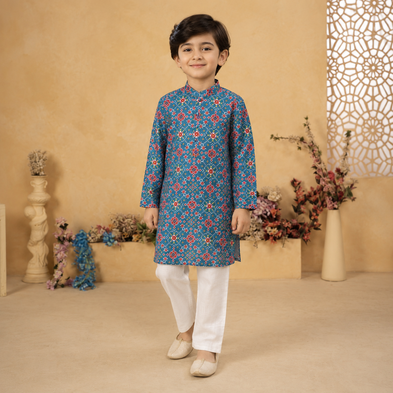 Crafted in 100% BCI-certified cotton, the kurta features an intricate all-over geometric floral print in rich shades of blue, red, and ivory, creating a look that feels both classic and vibrant.