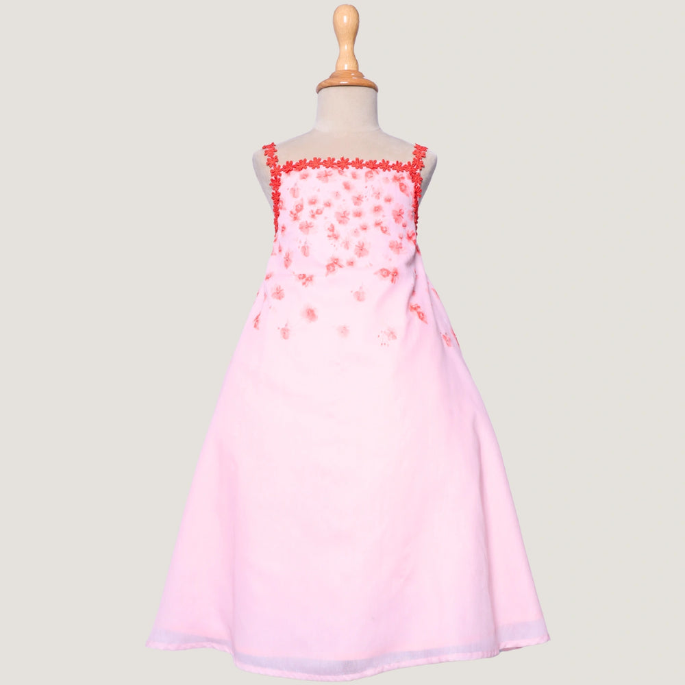 
                  
                    The Eira A-Line Dress is a playful ode to summer blooms. Crafted in a soft pink base, this sleeveless A-line dress features vibrant coral floral embroidery cascading from the neckline, with delicate flower appliqués adding texture and charm.
                  
                