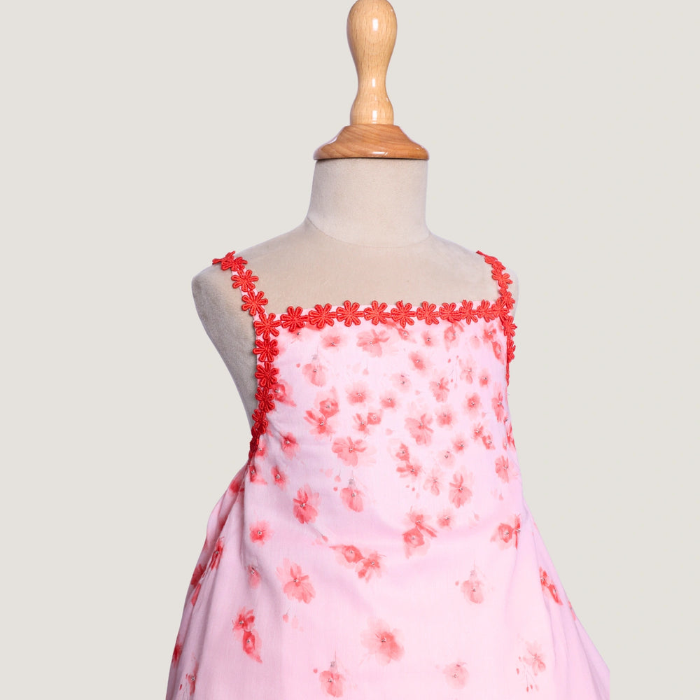 
                  
                    The Eira A-Line Dress is a playful ode to summer blooms. Crafted in a soft pink base, this sleeveless A-line dress features vibrant coral floral embroidery cascading from the neckline, with delicate flower appliqués adding texture and charm.
                  
                