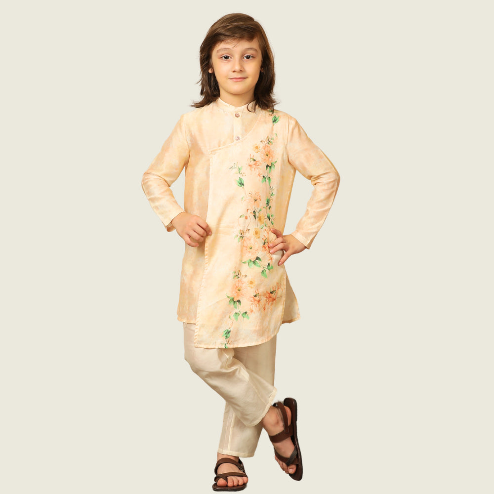 
                  
                    The Angrakha-style kurta for boys, features side tie detailing and a comfortable fit, paired with classic ivory pants for a clean, balanced look.
                  
                