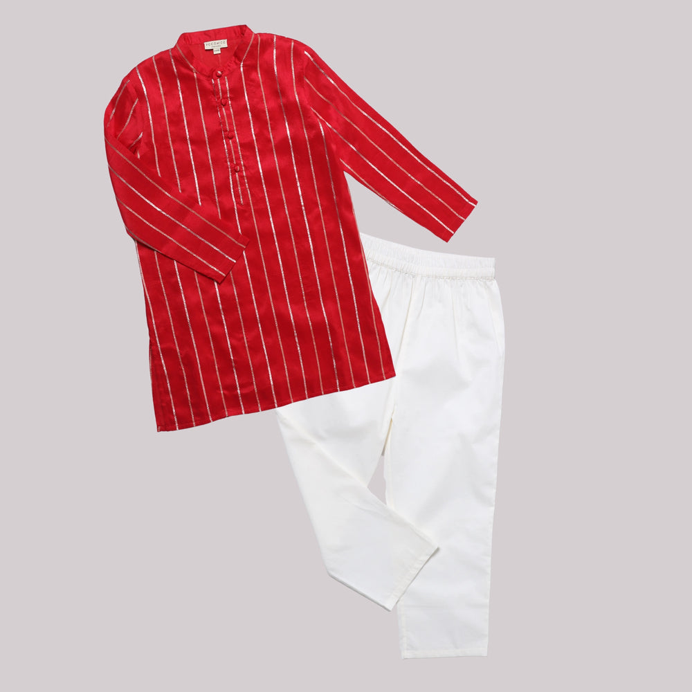 
                      
                        A red Chanderi kurta set for boys with a soft shimmer, paired with breathable white cotton pants, perfect for festive occasions.
                      
                    