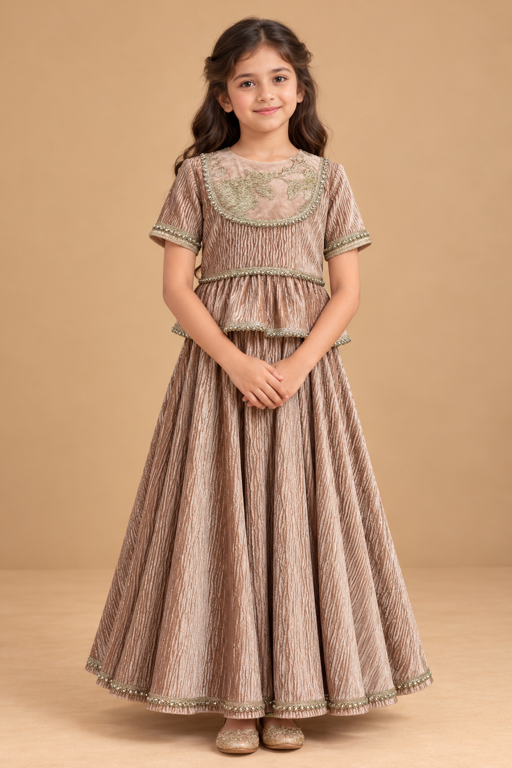 The Gulabi Shaam Velvet Lehenga Set brings together the richness of velvet and the delicate charm of antique-gold detailing. 