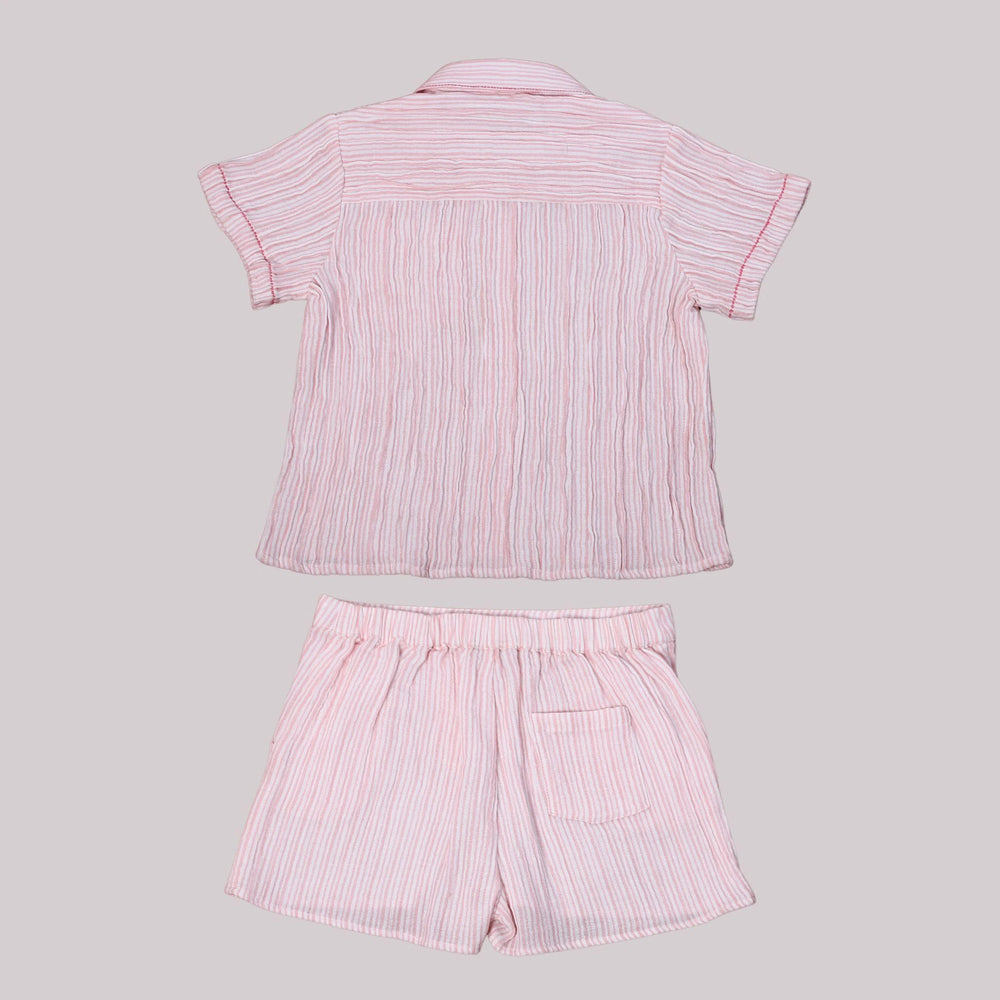 
                      
                        A boy wearing a stylish pink striped co-ord set, featuring double-needle stitching, made from eco-friendly cotton.
                      
                    