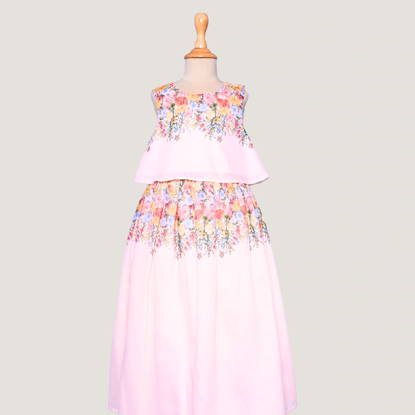 For your little girls who love to dress up, this light pink crop top and lehenga set is theperfect&nbsp; festive pick. Designed with breezy floral digital prints, it brings together the joy of summer and the charm of celebrations.