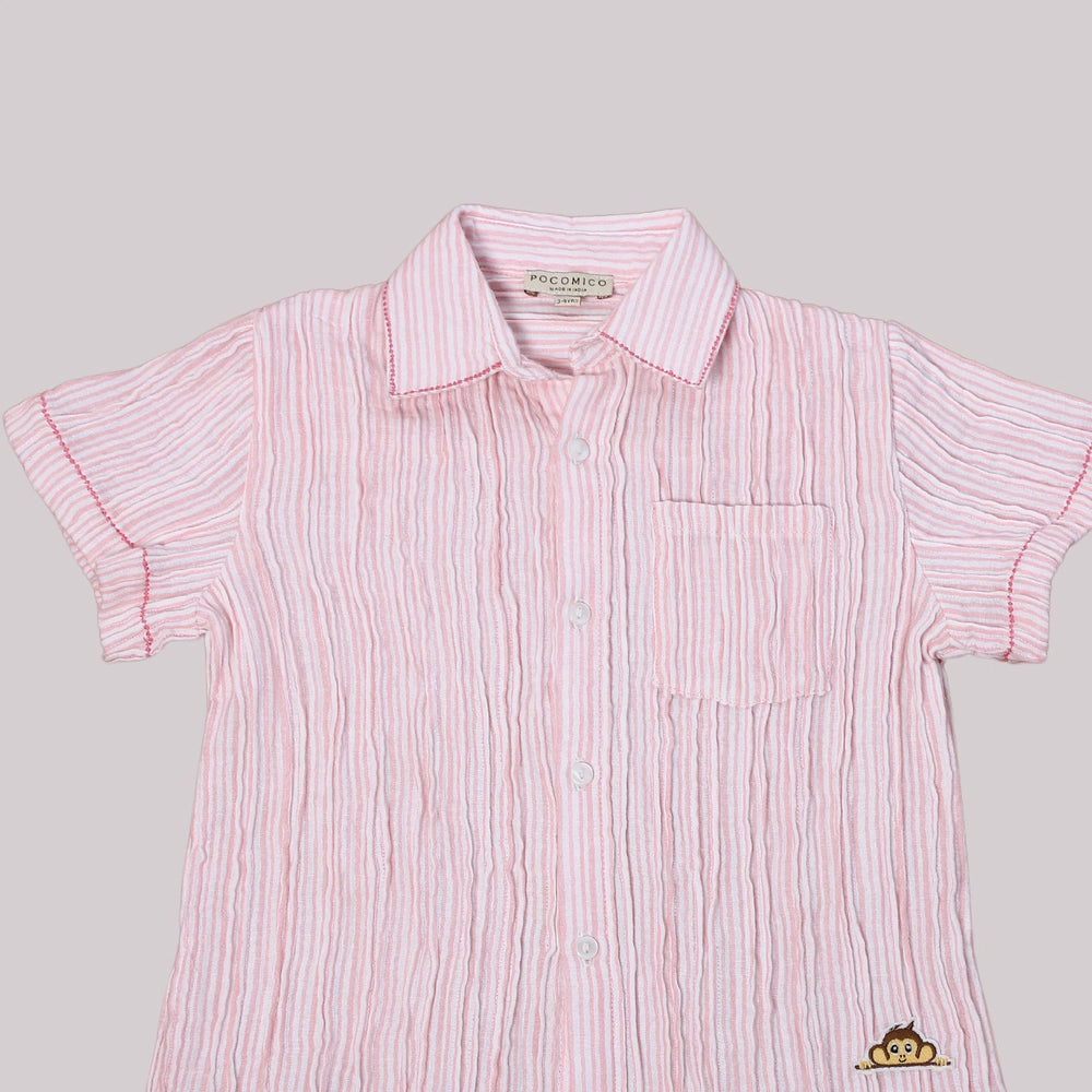 
                      
                        A boy wearing a stylish pink striped co-ord set, featuring double-needle stitching, made from eco-friendly cotton.
                      
                    