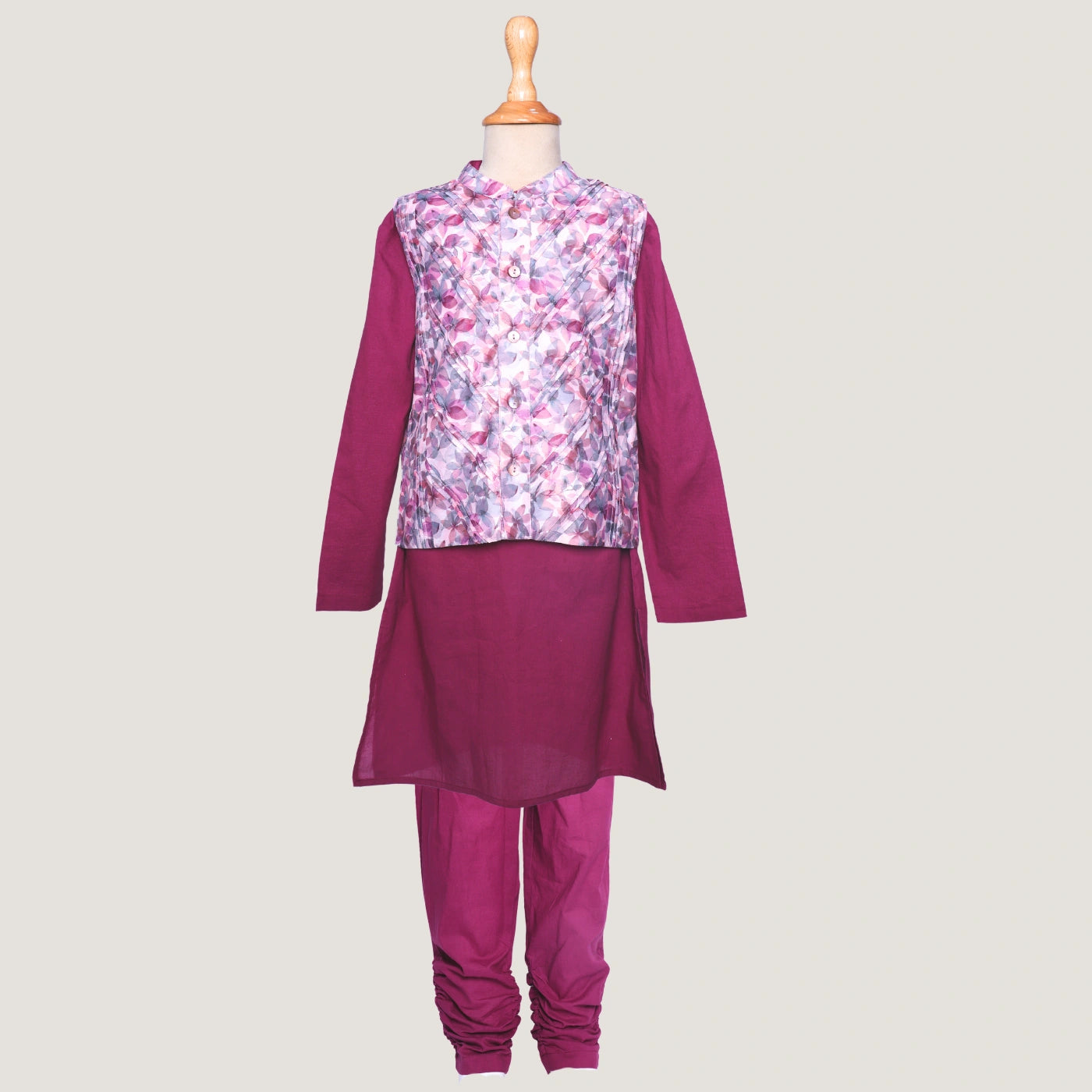 A statement piece for your little boys, this deep plum chanderi kurta set brings a royal charm to festive dressing. The kurta is tailored in lustrous chanderi fabric, featuring a straight silhouette with refined detailing that adds a sophisticated touch.
