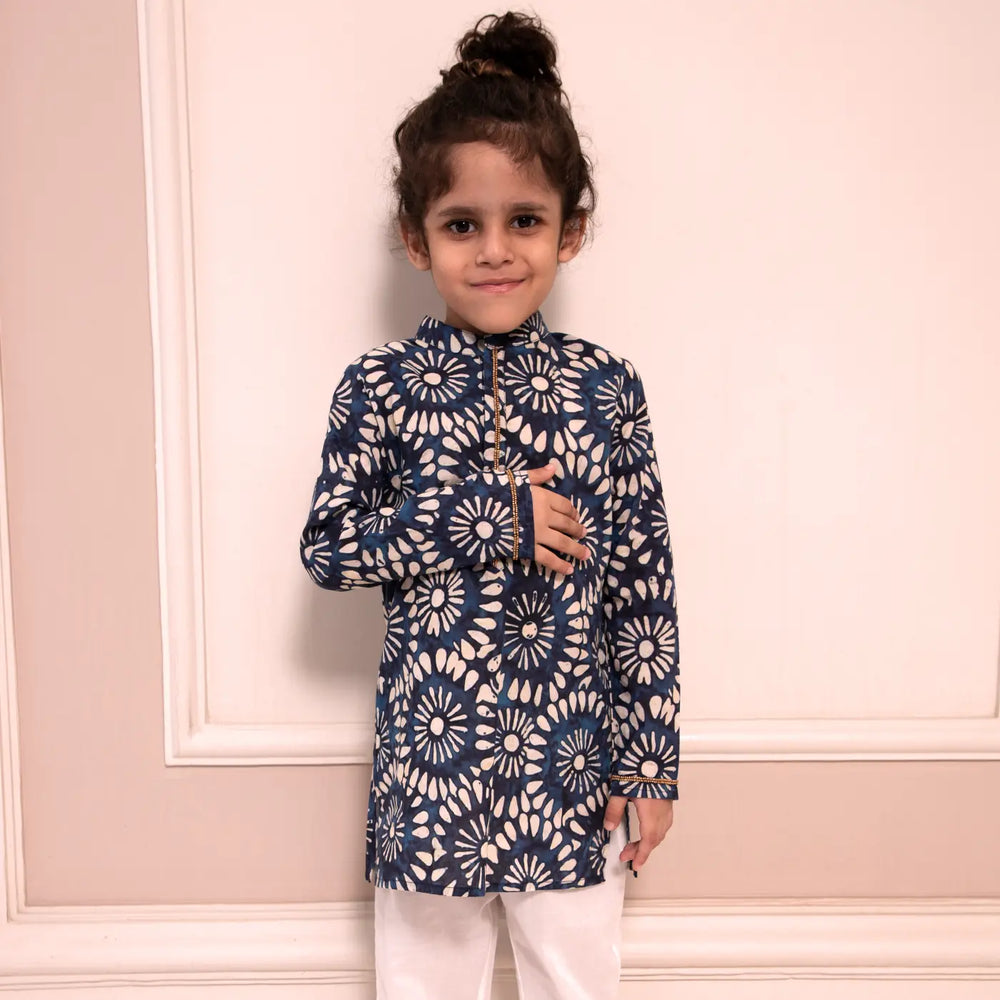 
                      
                        PocoMico’s Digital Printed Kurta with Hand Embroidery on the Placket and Cuff paired with White Pants 
                      
                    