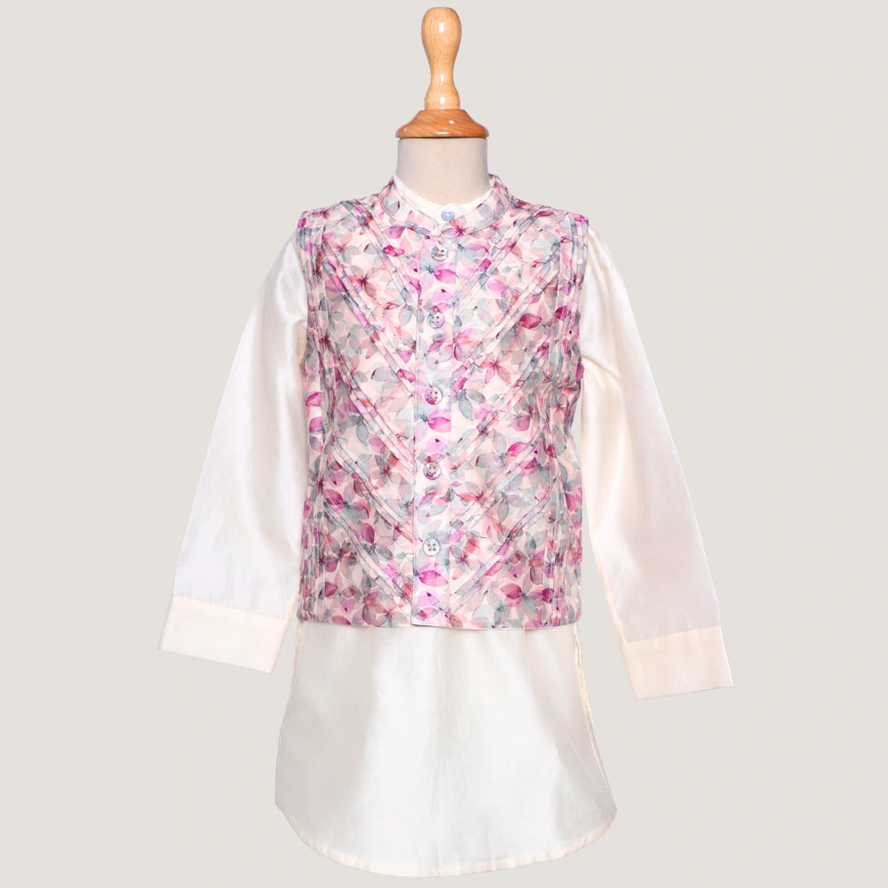
                  
                    This stylish kurta and jacket set for little boys blends tradition with a modern twist. The ivory chanderi kurta offers a soft, elegant base, while the digitally printed jacket steals the spotlight with its vibrant patterns and fine pintuck detailing for a sharp, structured look.
                  
                
