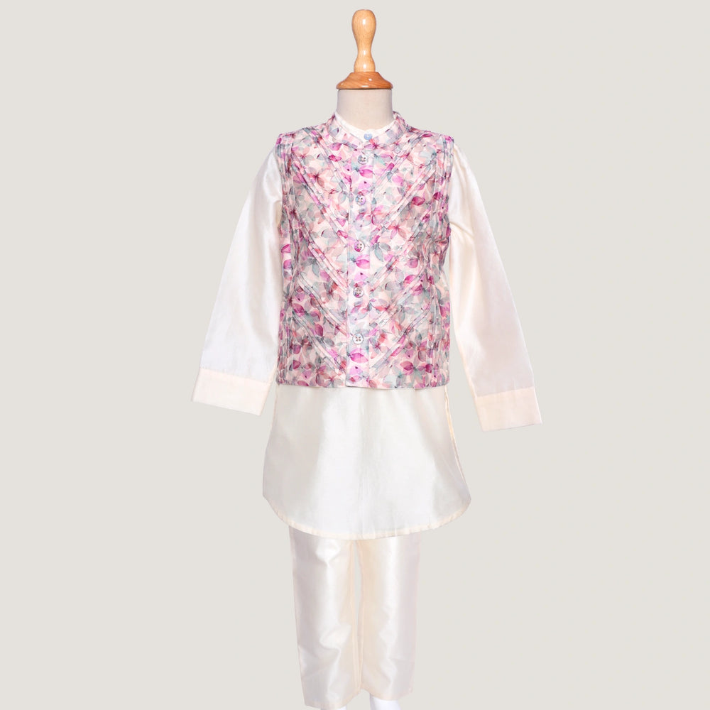 
                  
                    This stylish kurta and jacket set for little boys blends tradition with a modern twist. The ivory chanderi kurta offers a soft, elegant base, while the digitally printed jacket steals the spotlight with its vibrant patterns and fine pintuck detailing for a sharp, structured look.
                  
                