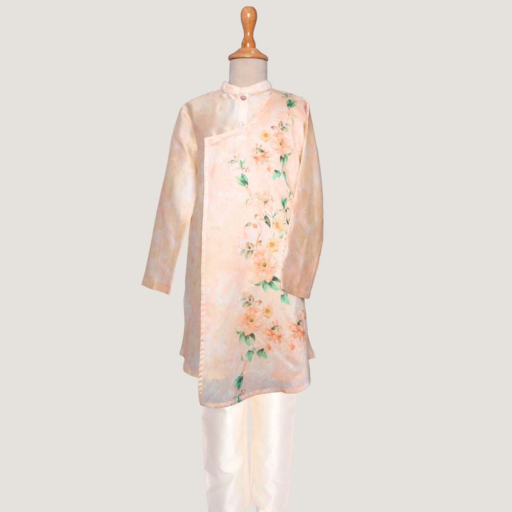 The Angrakha-style kurta features side tie detailing and a comfortable fit, paired with classic ivory pants for a clean, balanced look.