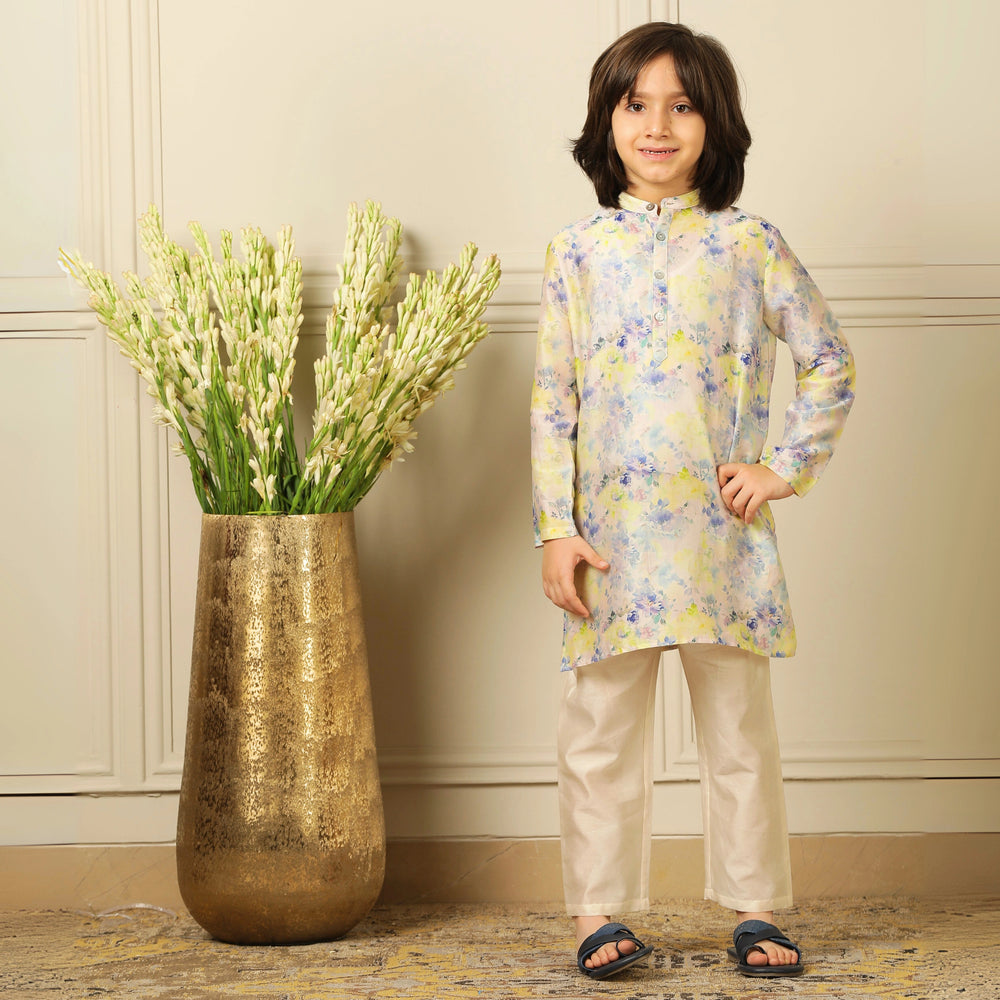 The kurta features a straight, comfortable silhouette with a soft sheen, making it ideal for long hours of celebration without compromising on style.