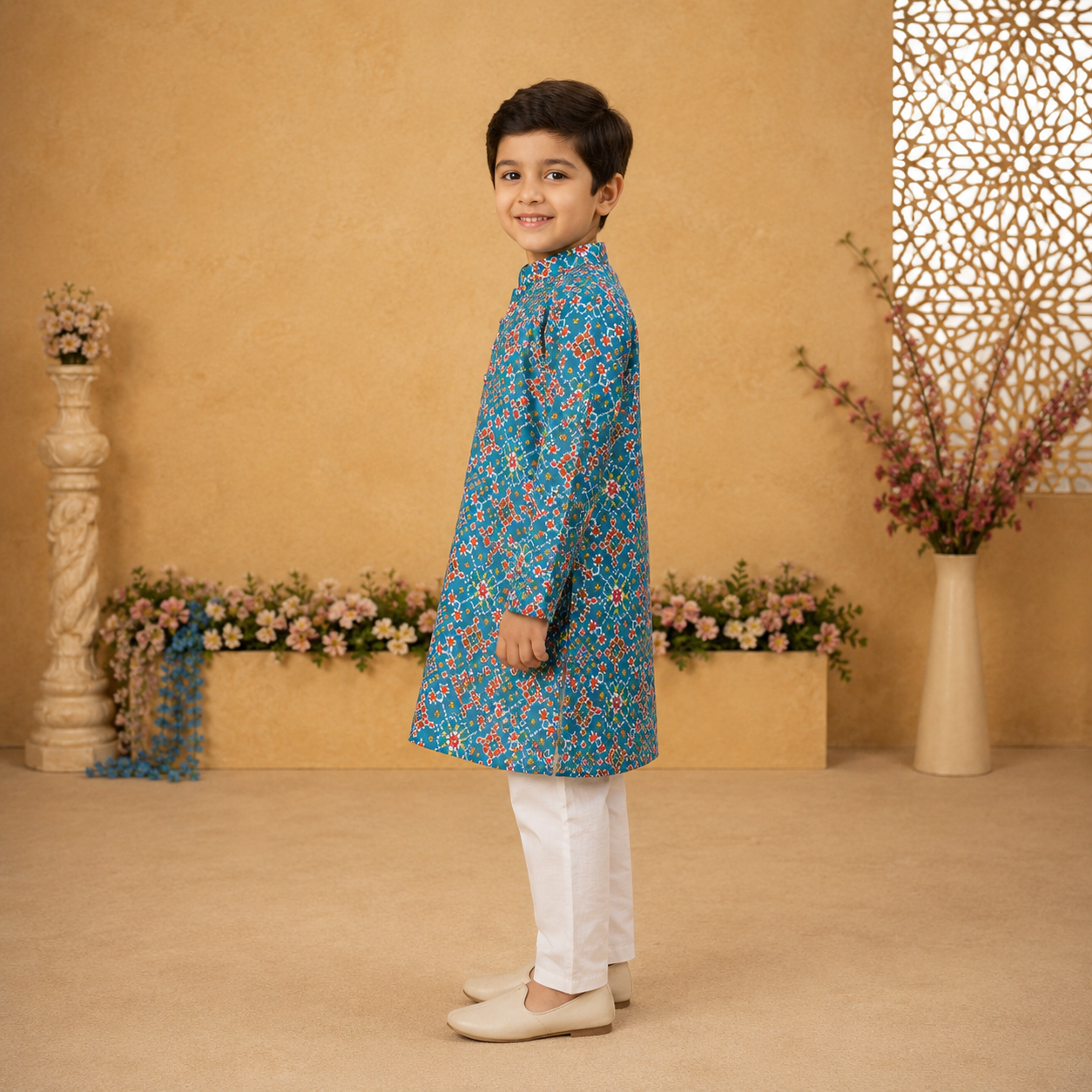 Crafted in 100% BCI-certified cotton, the kurta features an intricate all-over geometric floral print in rich shades of blue, red, and ivory, creating a look that feels both classic and vibrant.