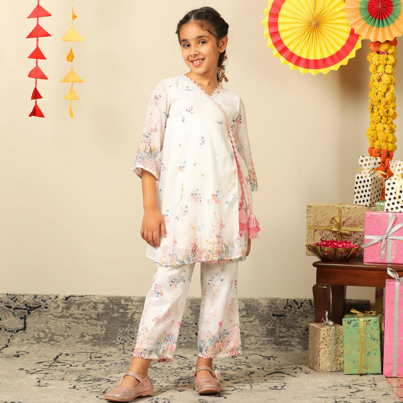  the Noor Kurti Set is a graceful ensemble perfect for dreamy celebrations. Set against a gentle white backdrop, the kurta features delicate multicolor floral prints scattered like wildflowers across the fabric. 