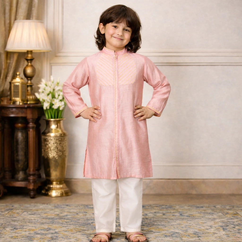 Child wearing a pink kurta with white pants in an elegant room, Peach Royale Kurta Set