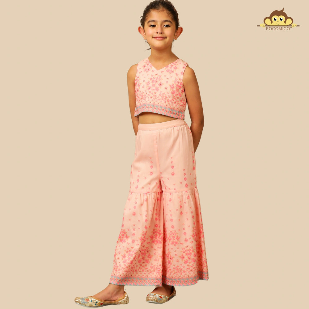 
                  
                    The Meher Sharara Set is a fresh and festive outfit designed for twirls and celebrations. Featuring a sleeveless crop top with a V-neckline and delicate floral embroidery, it’s paired with matching tiered sharara pants
                  
                