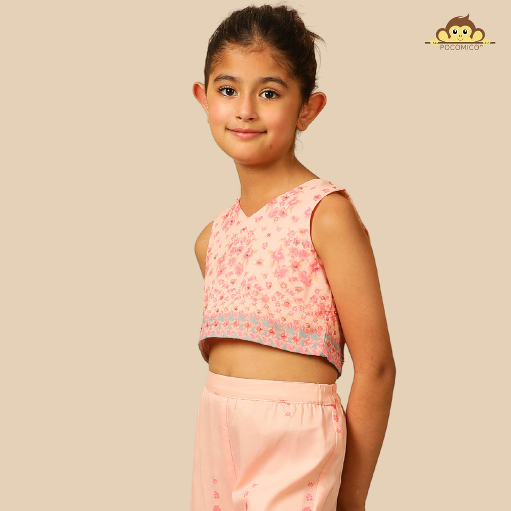 
                  
                    The Meher Sharara Set is a fresh and festive outfit designed for twirls and celebrations. Featuring a sleeveless crop top with a V-neckline and delicate floral embroidery, it’s paired with matching tiered sharara pants
                  
                