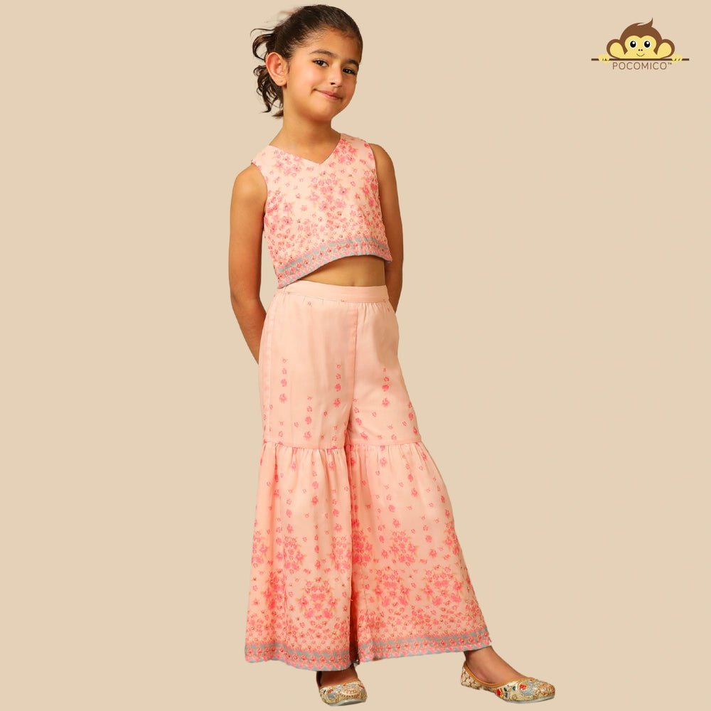 
                  
                    The Meher Sharara Set is a fresh and festive outfit designed for twirls and celebrations. Featuring a sleeveless crop top with a V-neckline and delicate floral embroidery, it’s paired with matching tiered sharara pants
                  
                