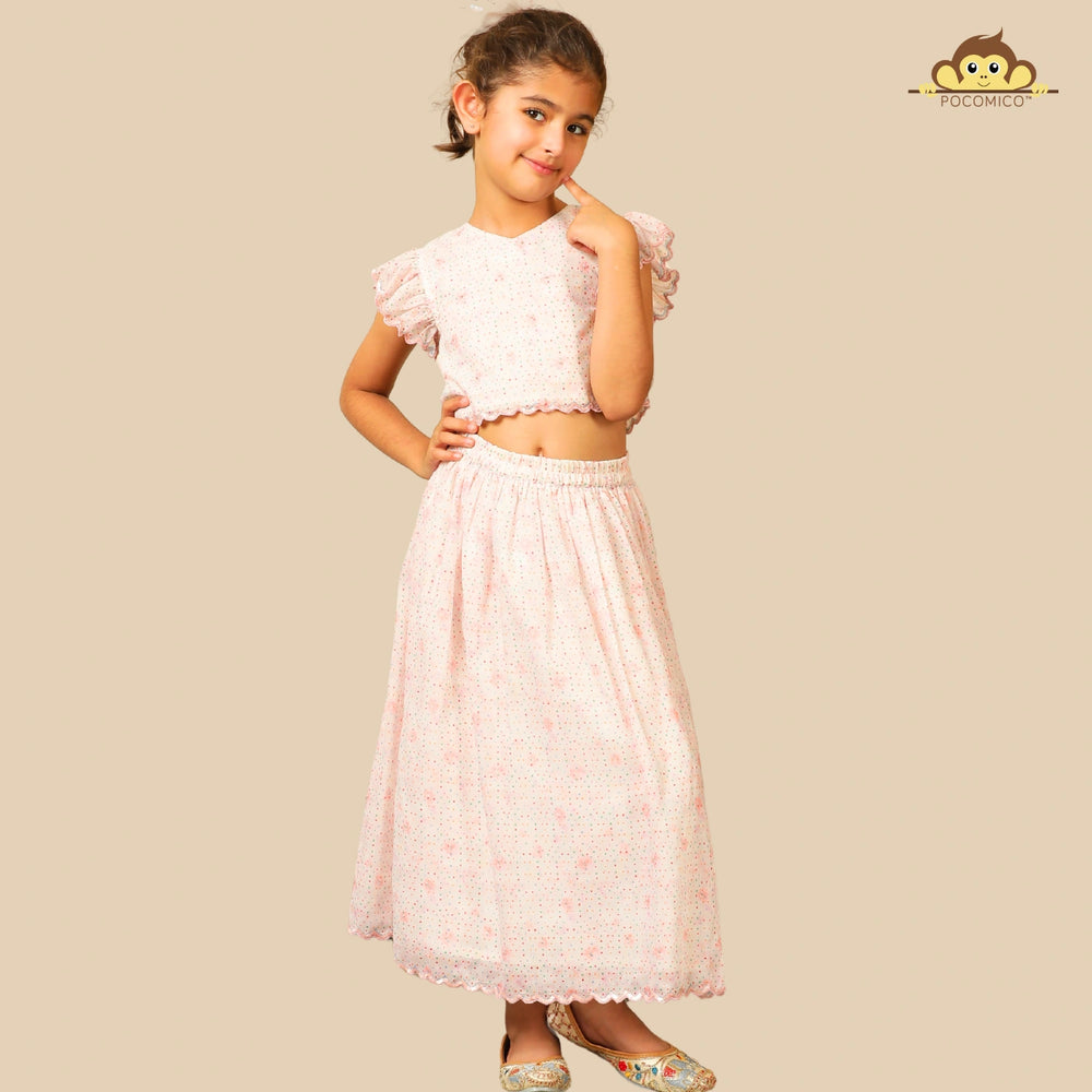 
                  
                    The Aabha Lehenga Dress Set is a sweet and sparkly outfit made for magical moments. Crafted in a soft pastel pink base, this dress is adorned with delicate floral prints and shimmering polka dots all over. 
                  
                