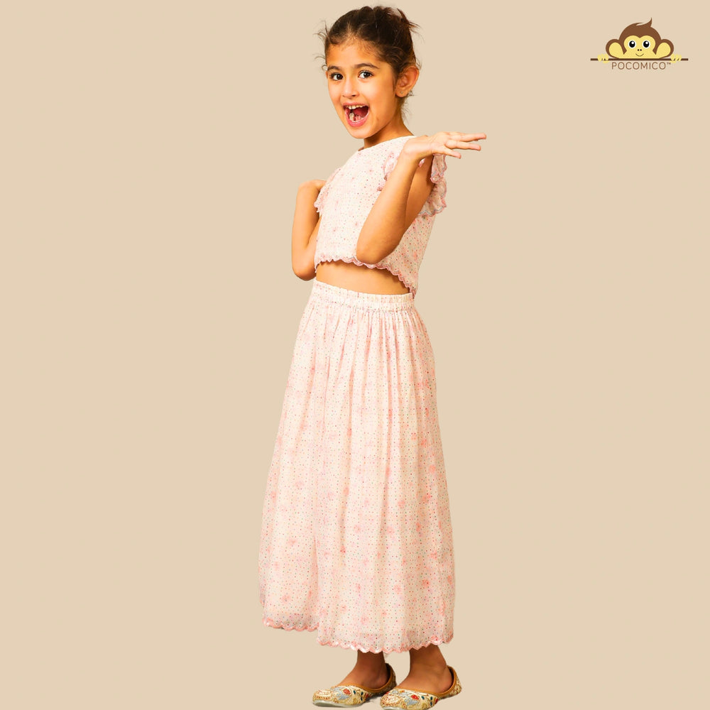 
                  
                    The Aabha Lehenga Dress Set is a sweet and sparkly outfit made for magical moments. Crafted in a soft pastel pink base, this dress is adorned with delicate floral prints and shimmering polka dots all over. 
                  
                