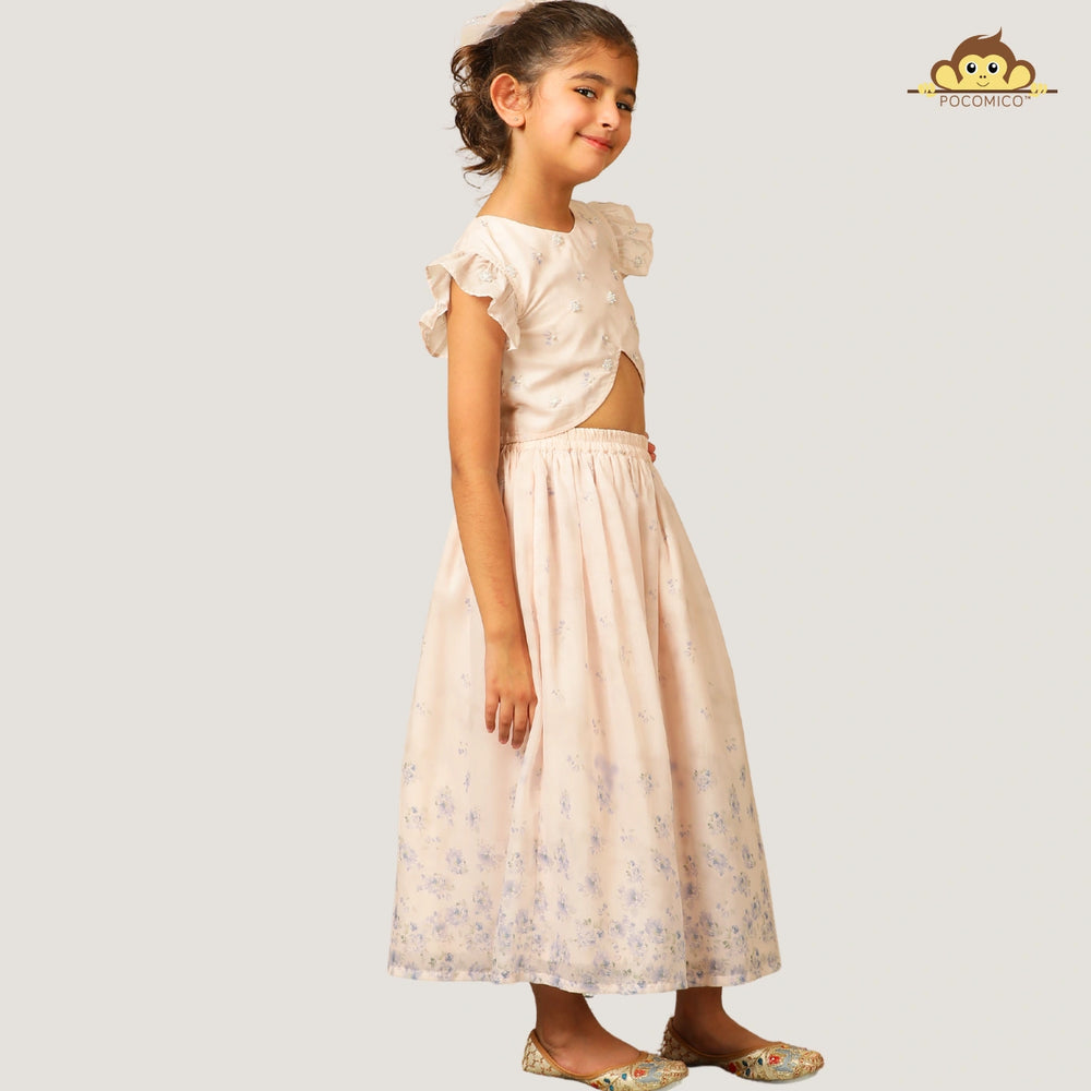 
                  
                    A soft and elegant pick for your little girls, this light blush pink chanderi lehenga set is designed for festive charm with a delicate touch. The lehenga features subtle linings and intricate beadwork, adding just the right amount of shimmer and grace.
                  
                