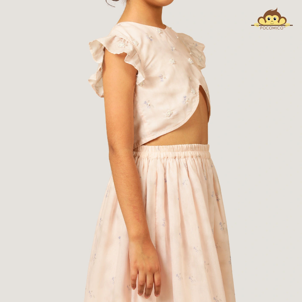 
                  
                    A soft and elegant pick for your little girls, this light blush pink chanderi lehenga set is designed for festive charm with a delicate touch. The lehenga features subtle linings and intricate beadwork, adding just the right amount of shimmer and grace.
                  
                