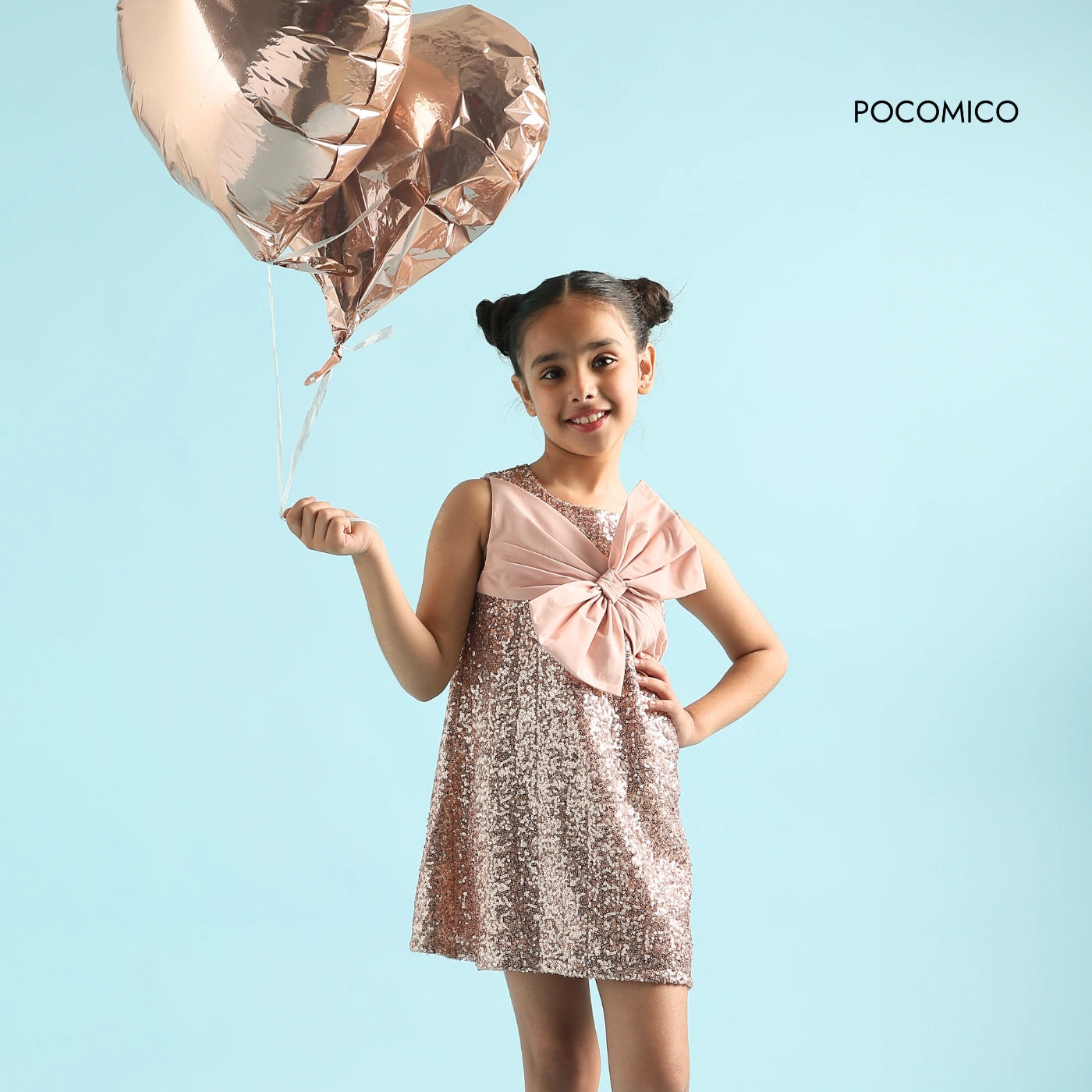 Peach+Princess+Bow+Dress+by+Pocomico+for+girls+who+love+to+shine+Sparkling+sequin+details+and+oversized+bow+make+this+dress+a+showstopper+Soft+mesh+fabric+with+a+comfortable+BCI-certified+cambric+lining+Ultimate+party+dress+for+kids,+perfect+for+sparkling+celebrations+Dress+your+little+one+in+a+dazzling+Peach+Princess+Bow+Dress!