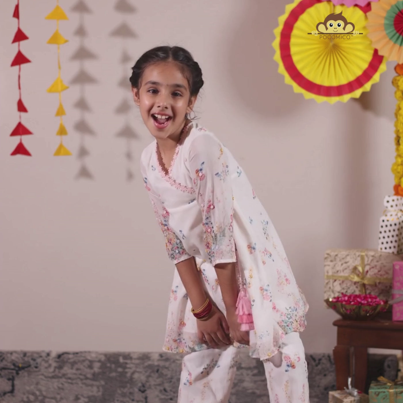  the Noor Kurti Set is a graceful ensemble perfect for dreamy celebrations. Set against a gentle white backdrop, the kurta features delicate multicolor floral prints scattered like wildflowers across the fabric. 