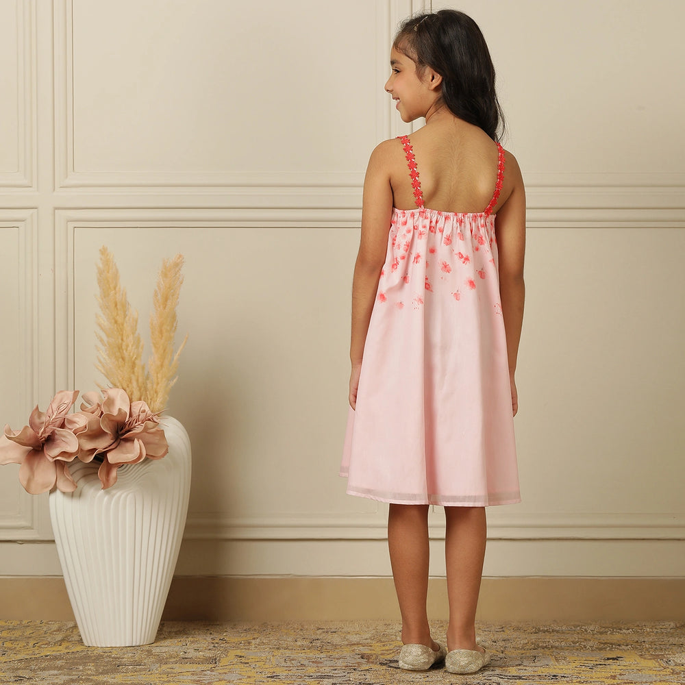 
                  
                    The Eira A-Line Dress is a playful ode to summer blooms. Crafted in a soft pink base, this sleeveless A-line dress features vibrant coral floral embroidery cascading from the neckline, with delicate flower appliqués adding texture and charm.
                  
                