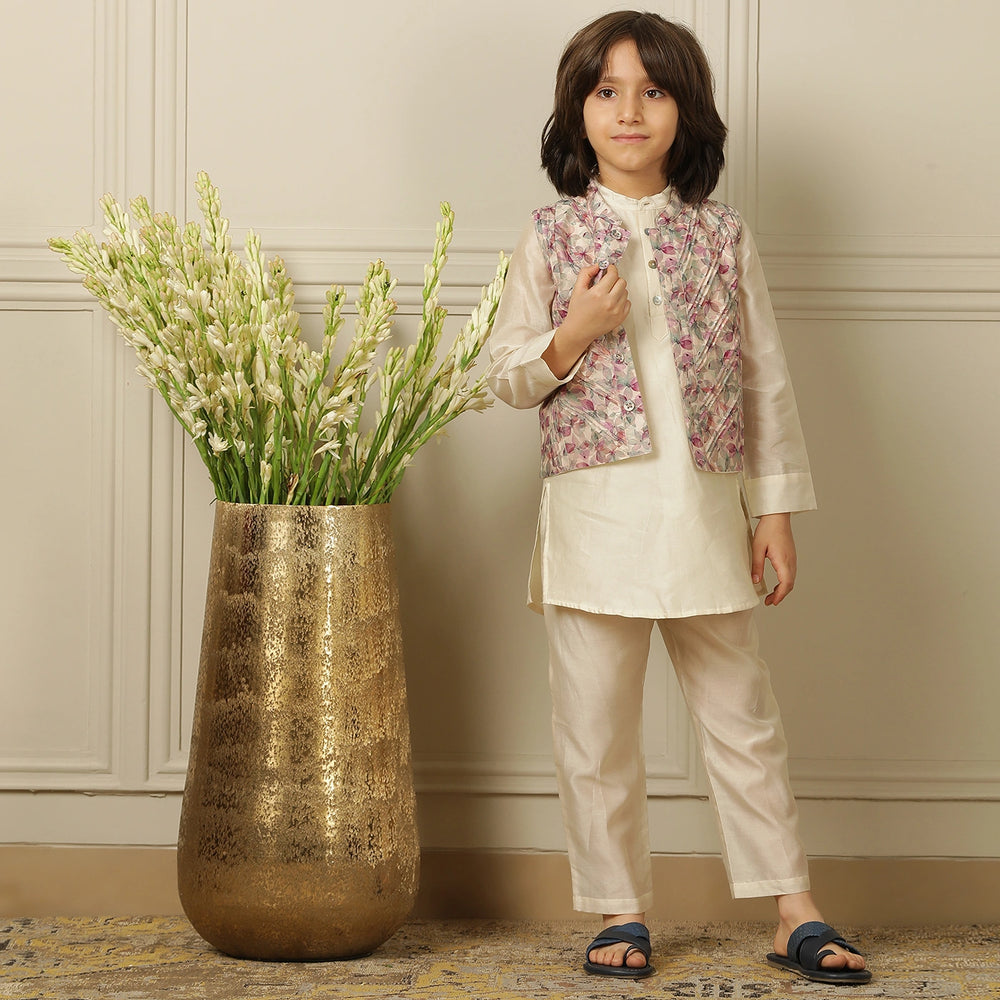 
                  
                    Elegant and festive, ivory chanderi kurta set for boys features delicate digital prints paired with matching embroidery on the sleeves
                  
                