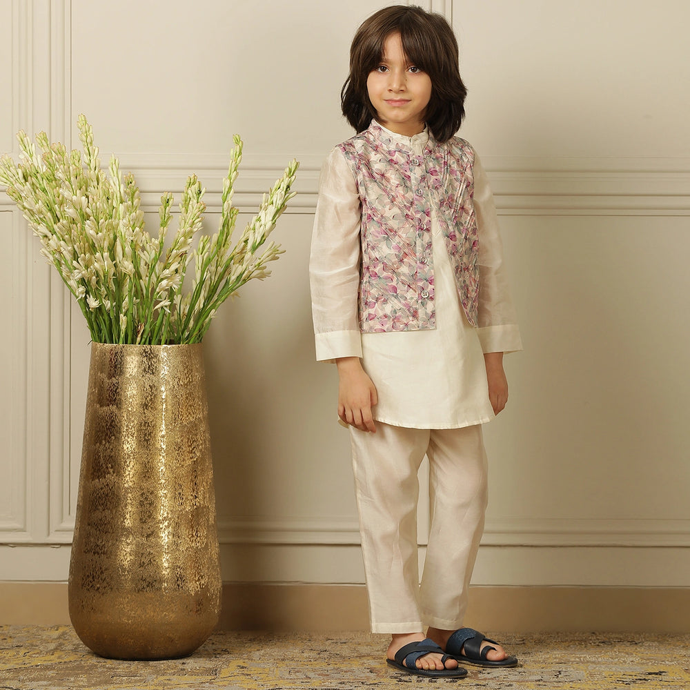
                  
                    Elegant and festive, ivory chanderi kurta set for boys features delicate digital prints paired with matching embroidery on the sleeves
                  
                