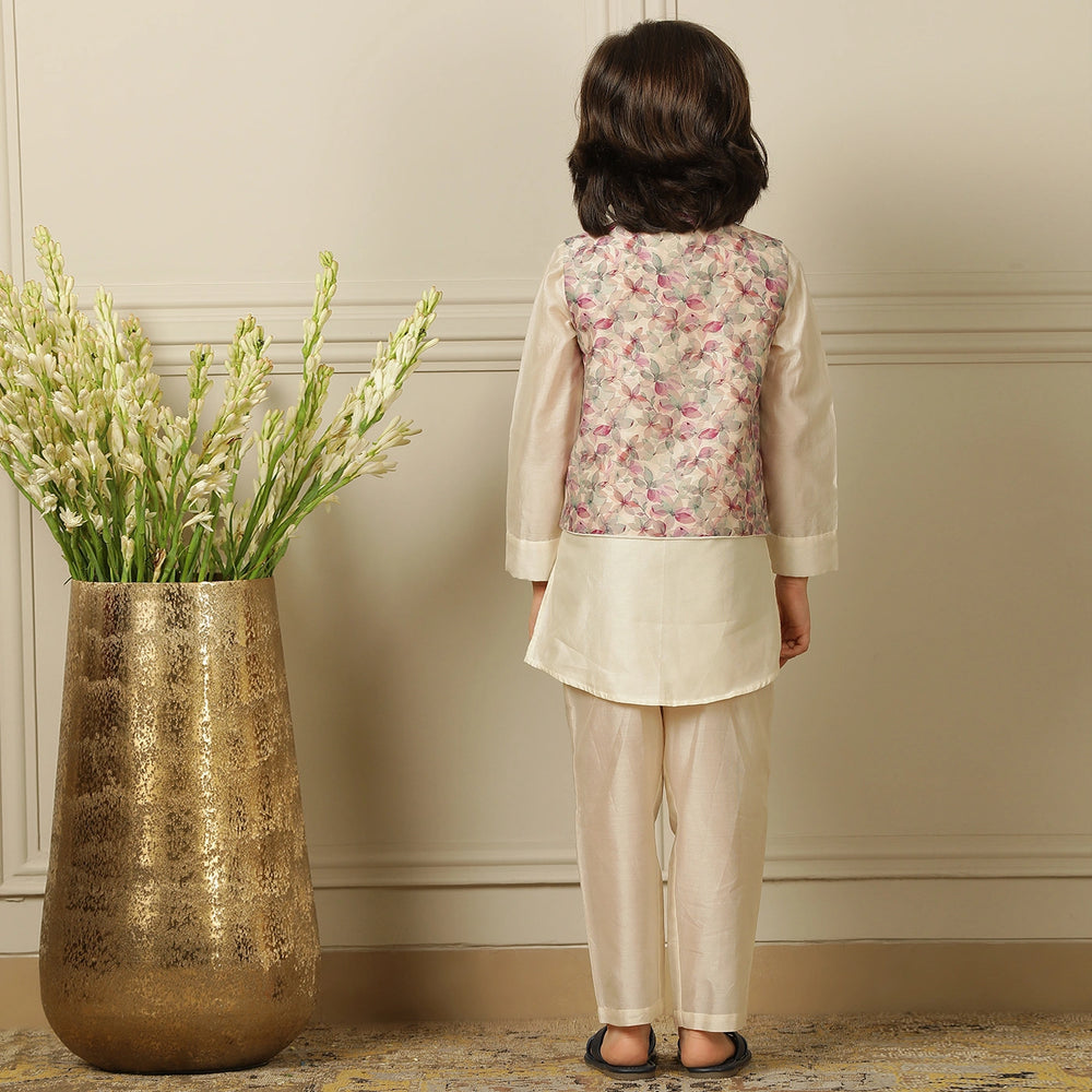 
                  
                    Elegant and festive, ivory chanderi kurta set for boys features delicate digital prints paired with matching embroidery on the sleeves
                  
                