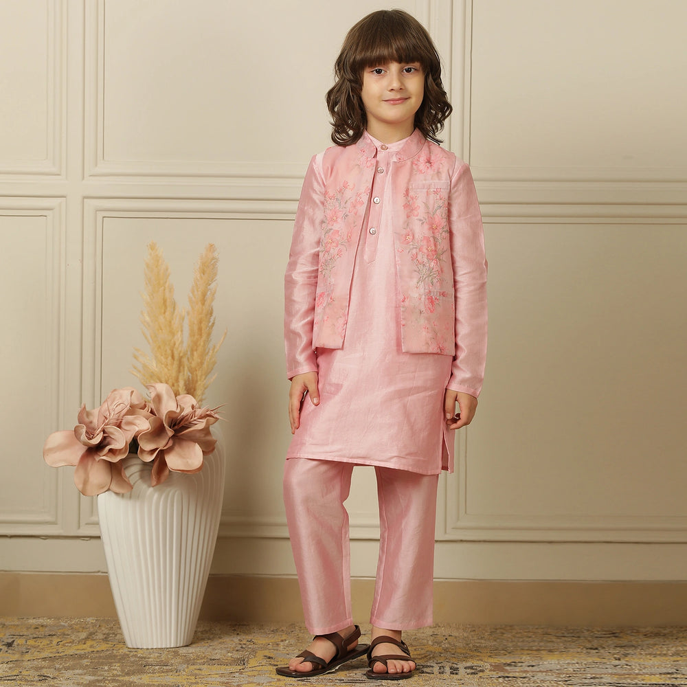 
                  
                    The Gulbahaar set is a graceful ode to festive tradition, featuring a pastel pink chanderi kurta paired with straight pants and a finely embroidered Nehru jacket blooming with soft floral design. 
                  
                